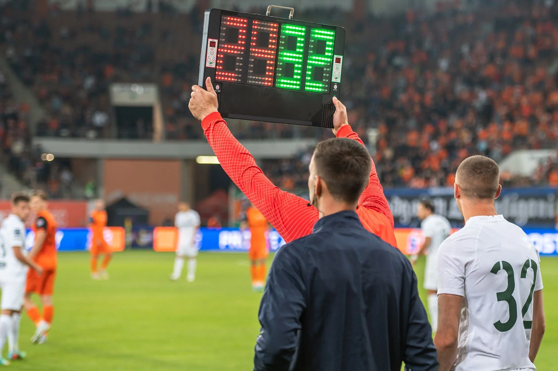 sub coming in for a another player - football match