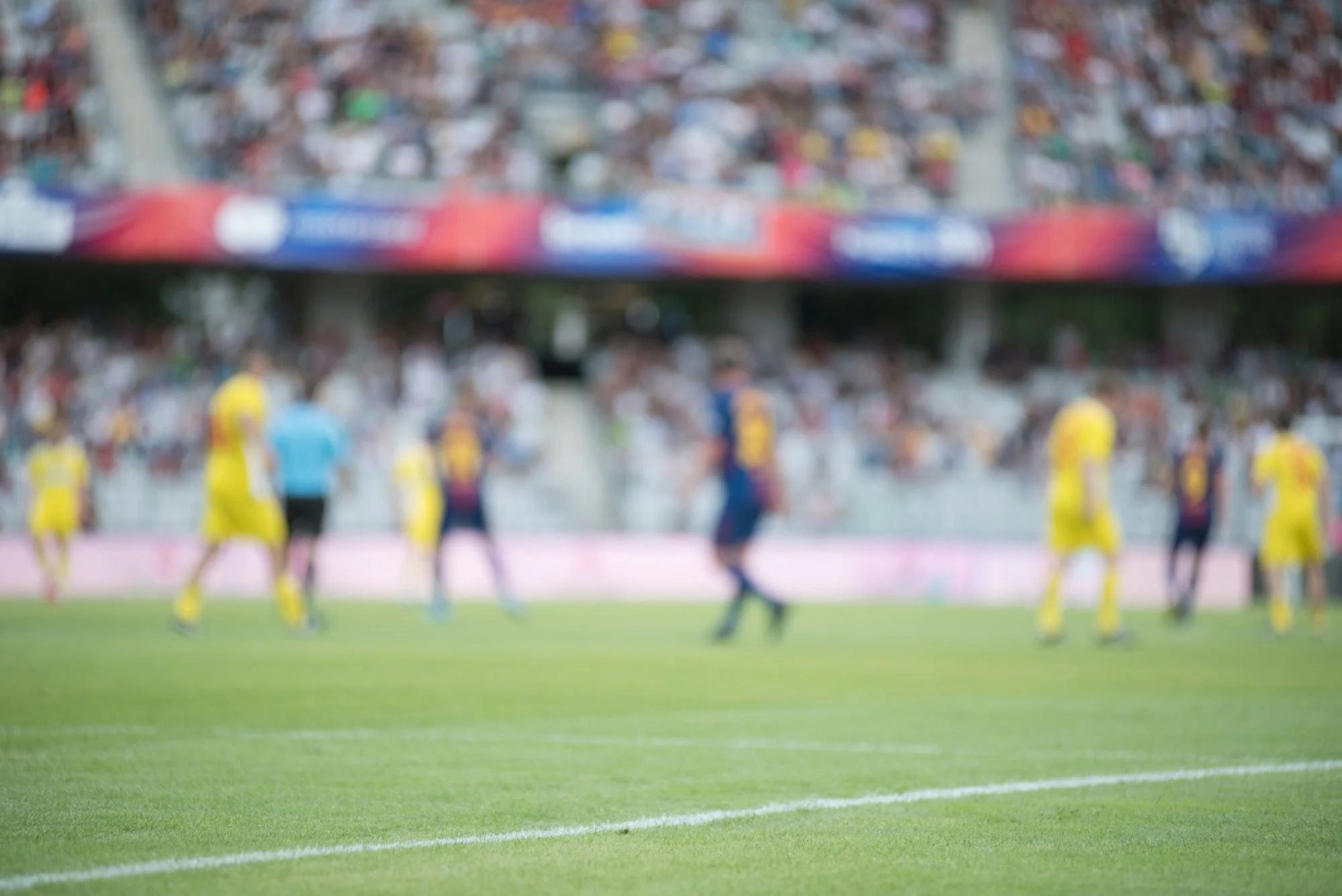 Players on football pitch - blurred view